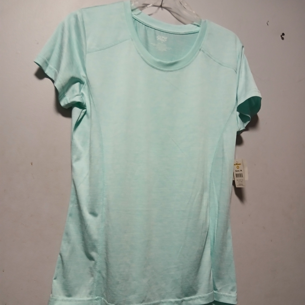 Zone pro NWT  ladies light blue  Pullover top. Short Sleeve,  Size Medium.